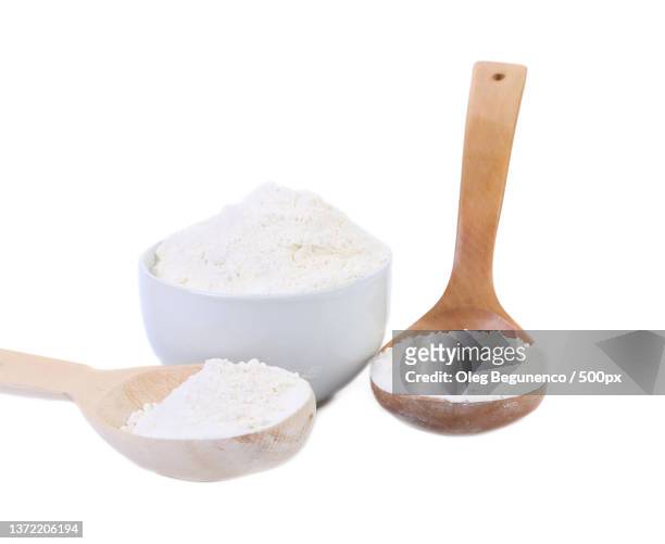 spoon and bowl with flour,close-up of sugar in wooden spoon against white background,moldova - sugar bowl crockery stock pictures, royalty-free photos & images