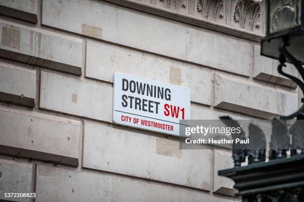 sign for downing street on side of building in london - prime minister stock pictures, royalty-free photos & images