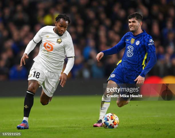 Renato Sanches of Lille OSC is challenged by Christian Pulisic of Chelsea during the UEFA Champions League Round Of Sixteen Leg One match between...