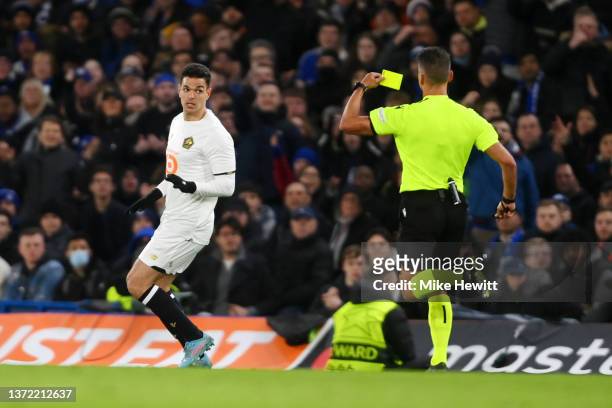 Hatem Ben Arfa of Lille OSC is shown a yellow card during the UEFA Champions League Round Of Sixteen Leg One match between Chelsea FC and Lille OSC...