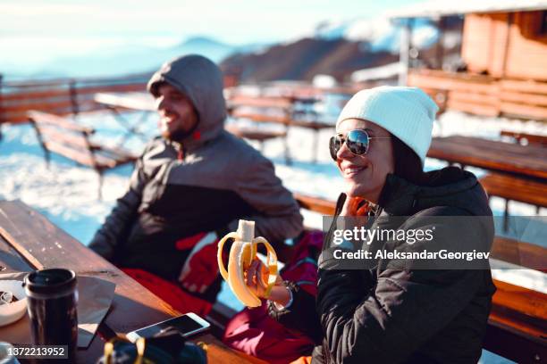 happy couple enjoying winter vacation with healthy food and drinks - winter skin stock pictures, royalty-free photos & images
