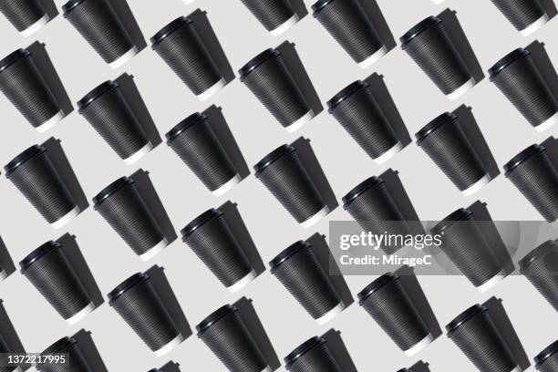 disposable paper cup repetition pattern - take away coffee cup stock pictures, royalty-free photos & images