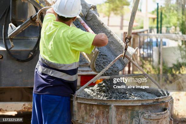 construction site worker men standing preparation and protective safety clothes - betonmischer stock-fotos und bilder