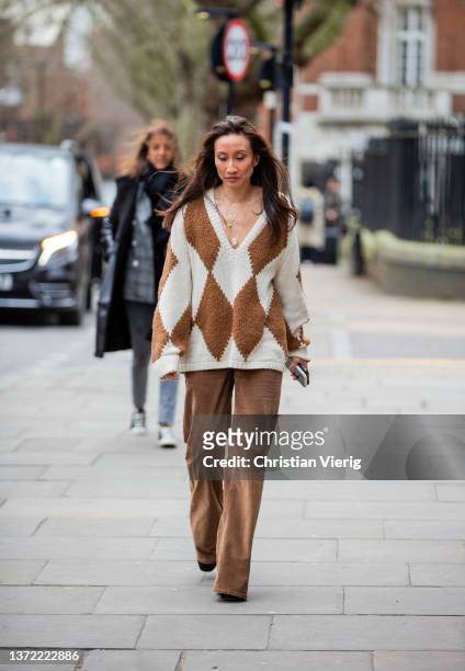 Elizabeth von der Goltz seen wearing brown creme white checkered jumper, brown pants outside Erdem during London Fashion Week February 2022 on...