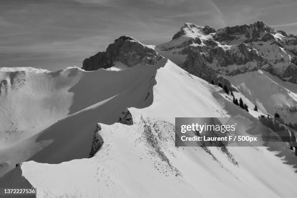 scenic view of snowcapped mountains against sky,novel,france - landscape black and white stock pictures, royalty-free photos & images