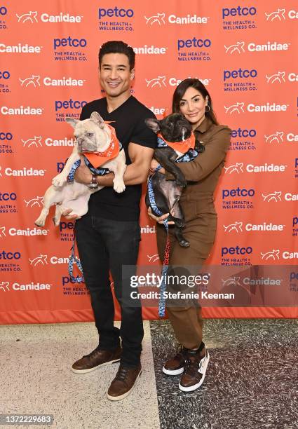 Mario Lopez and Courtney Lopez attend Canidae's Puppy Playdate Event, celebrating the launch of its first Kibble Refill Station on February 22, 2022...