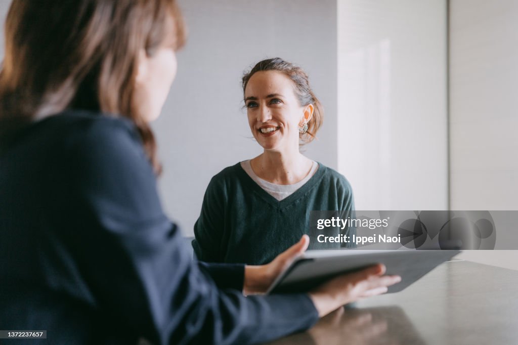 Woman meeting female banker for financial advice