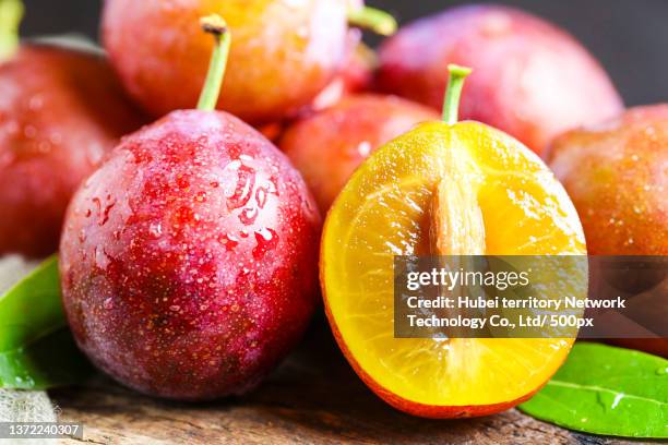 xinjiang plum on the wooden bottom - 梅 ストックフォトと画像