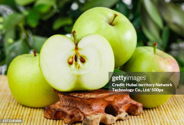 apples on the wooden bottom - fruit flesh stock pictures, royalty-free photos & images