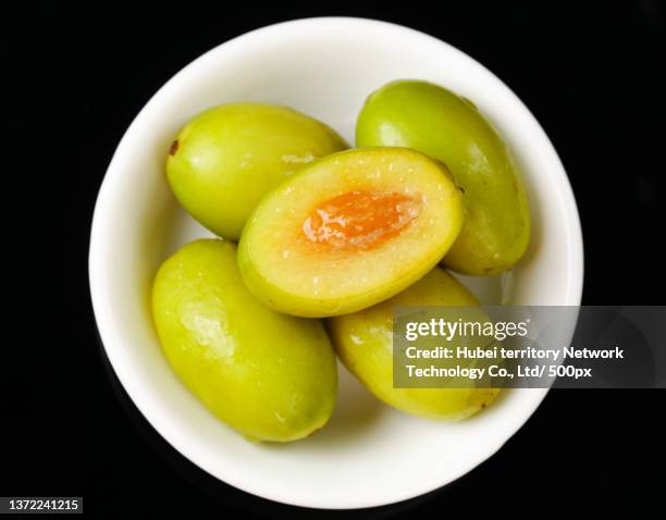 sweet olives on the deep bottom - fruktkött bildbanksfoton och bilder