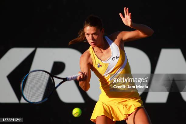 Chloe Paquet of France hits a forehand during a match between Rebeka Masarova of Spain and Chloe Paquet of France as part of day 2 of the AKRON WTA...