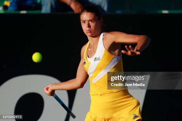 Chloe Paquet of France hits a forehand during a match between Rebeka Masarova of Spain and Chloe Paquet of France as part of day 2 of the AKRON WTA...