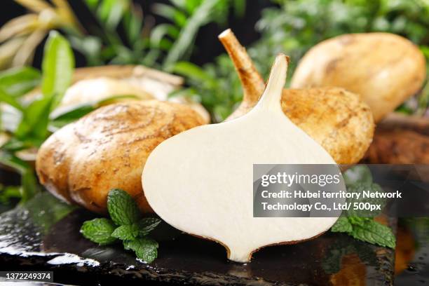 guangxi sweet potatoes are placed on the deep bottom - jicama stock-fotos und bilder