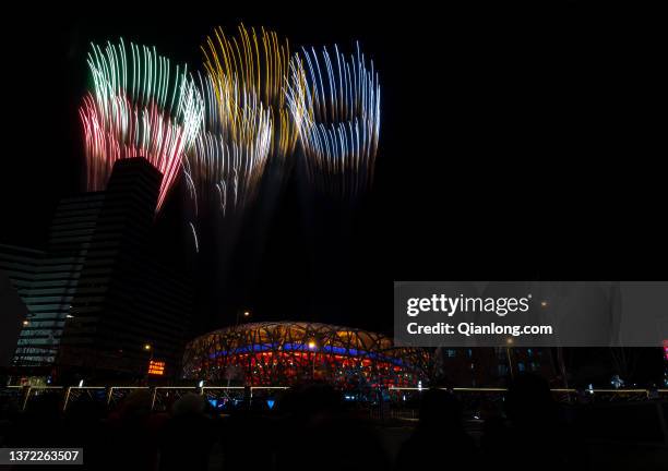 Fireworks explode over the Beijing National Stadium during the closing ceremony of the Beijing 2022 Winter Olympics on February 20, 2022 in Beijing,...