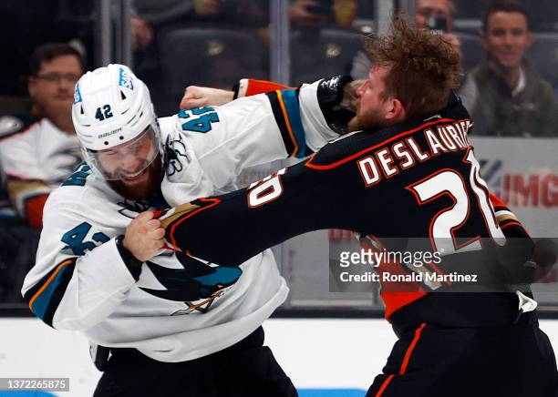 Jonah Gadjovich of the San Jose Sharks and Nicolas Deslauriers of the Anaheim Ducks fight in the first period at Honda Center on February 22, 2022 in...
