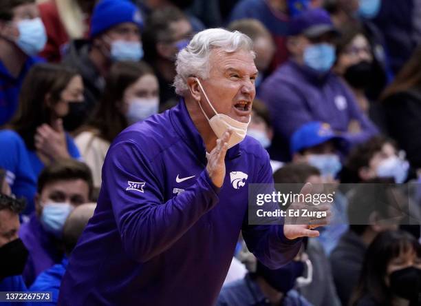 Head coach Bruce Weber of the Kansas State Wildcats directs his team against the Kansas Jayhawks in the first half at Allen Fieldhouse on February...