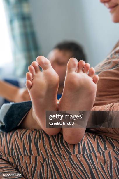 disabled partially blind boy soles of bare feet - teen soles stock pictures, royalty-free photos & images