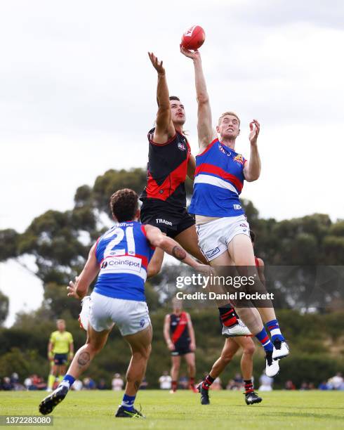 Sam Draper of the Bombers and Tim English of the Bulldogs contest the ruck during an AFL practice match between the Essendon Bombers and the Western...