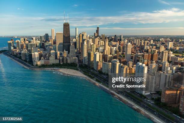 aerial chicago skyscrapers oak street beach lake michigan - michigan v illinois stock-fotos und bilder