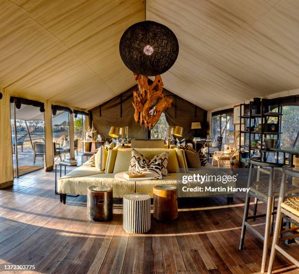 luxury tented lounge area of the gomoti plains tented camp, botswana - zeltplatz stock-fotos und bilder