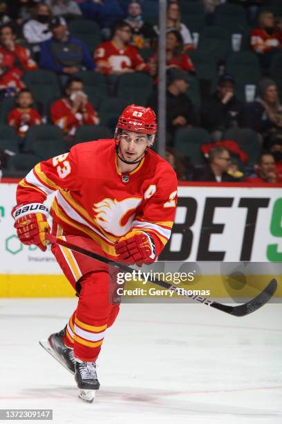 Sean Monahan of the Calgary Flames skates up ice against the Columbus Blue Jackets at Scotiabank Saddledome on February 15, 2022 in Calgary, Alberta,...