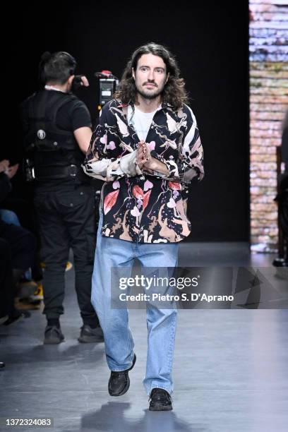 Fashion designer Marco Rambaldi acknowledges the applause of the audience at the Marco Rambaldi fashion show during the Milan Fashion Week...