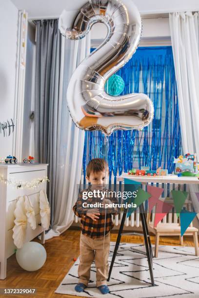 boys second birthday at home - number 2 balloon stock pictures, royalty-free photos & images