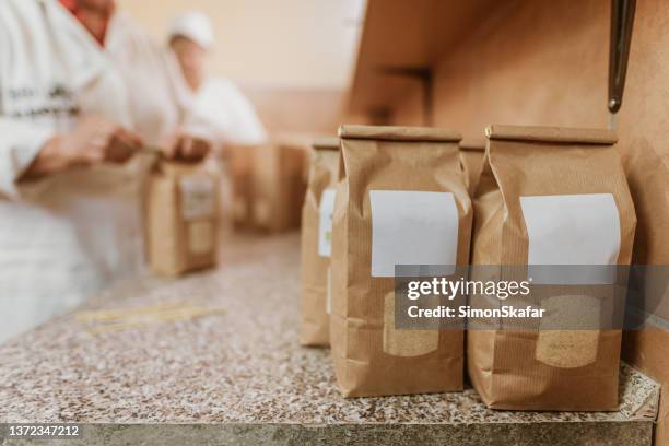 flour paper bags with empty space to place label on table - flour packaging stock pictures, royalty-free photos & images