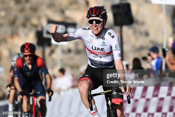 Tadej Pogacar of Slovenia and UAE Team Emirates white best young jersey celebrates winning ahead of Adam Yates of United Kingdom and Team INEOS...