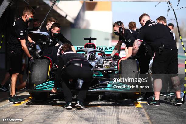 Lewis Hamilton of Great Britain driving the Mercedes AMG Petronas F1 Team Mercedes W13 in pitlane during Day One of F1 Testing at Circuit de...