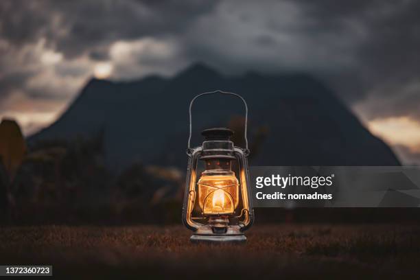 classic lanterns hanging on poles - camping lantern stock pictures, royalty-free photos & images