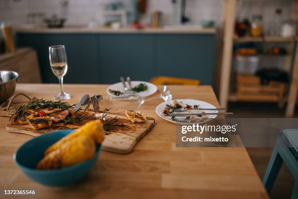 high angle view of leftovers on dining table - leftovers stockfoto's en -beelden