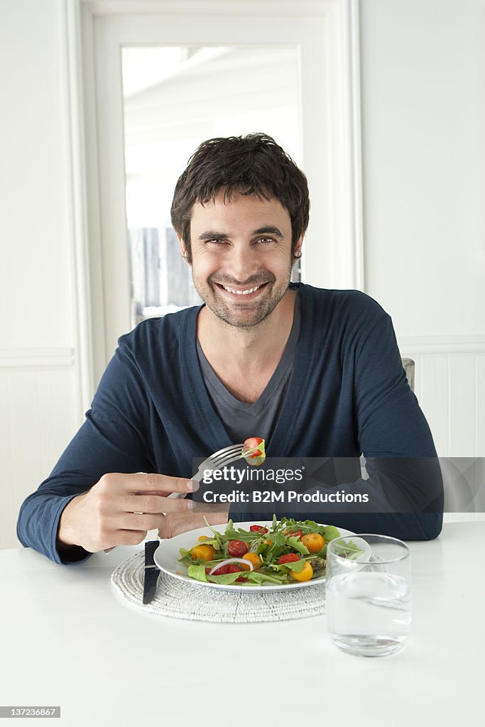 Portrait Of Man Eating Salad