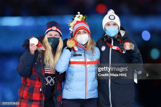 Gold medallist Therese Johaug of Team Norway , Silver medallist Jessie Diggins of Team United States and Bronze medallist Kerttu Niskanen of Team...