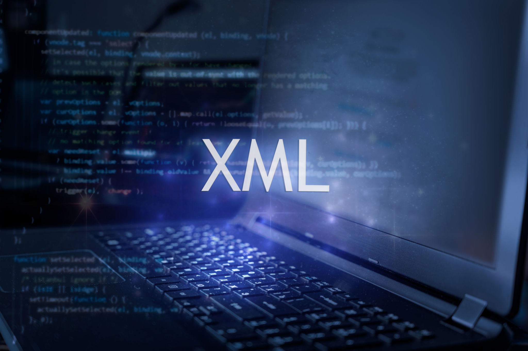 XML inscription against laptop and code background. XML inscription against laptop and code background.