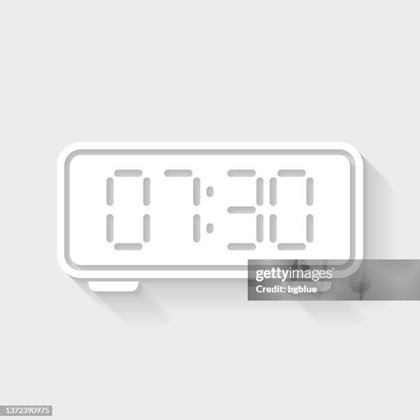 digital clock. icon with long shadow on blank background - flat design - number 7 clock stock illustrations