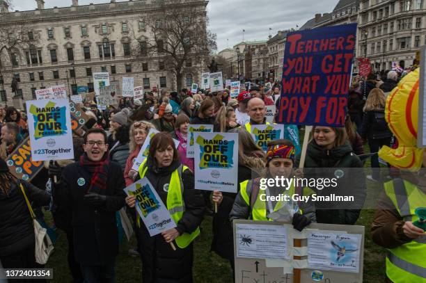 Striking teachers hold a rally in Parliament square during their action organised by the NEU on February 23, 2022 in London, England.