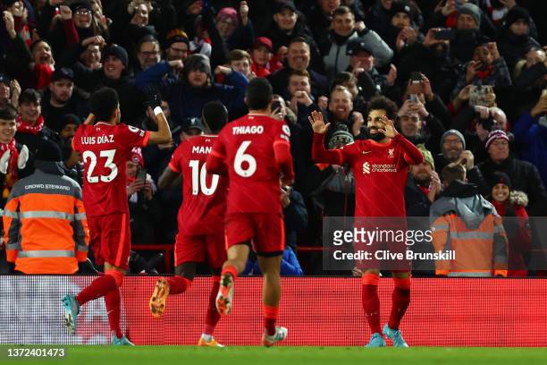 Mohamed Salah of Liverpool celebrates with teammates after scoring their team's third goal during the Premier League match between Liverpool and...