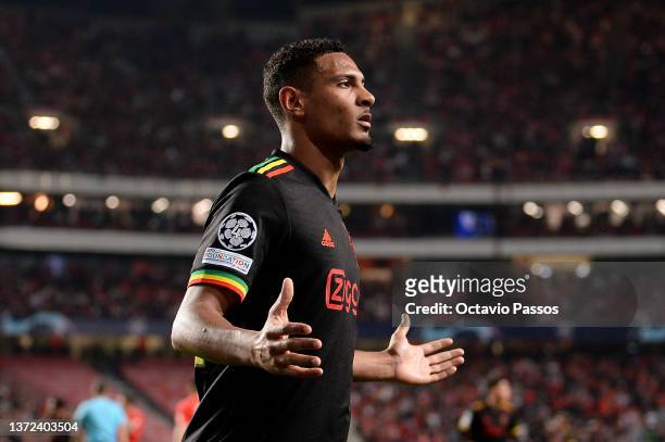 Sebastien Haller of Ajax celebrates after scoring their team's second goal during the UEFA Champions League Round Of Sixteen Leg One match between SL...
