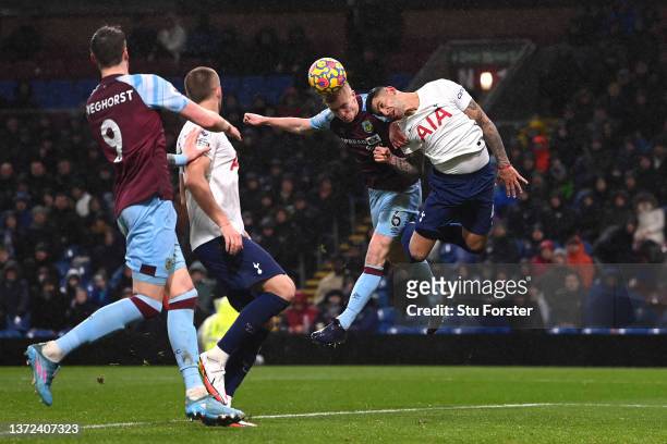 Ben Mee of Burnley scores their team's first goal during the Premier League match between Burnley and Tottenham Hotspur at Turf Moor on February 23,...