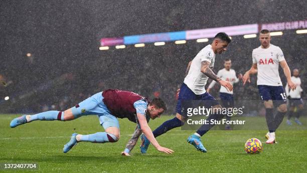 Cristian Romero of Tottenham Hotspur is challenged by Wout Weghorst of Burnley during the Premier League match between Burnley and Tottenham Hotspur...