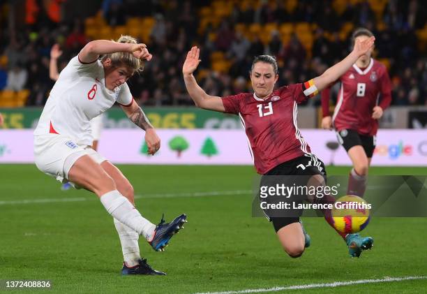 Millie Bright of England scores their team's second goal past Sara Daebritz of Germany during the Arnold Clark Cup match between England and Germany...