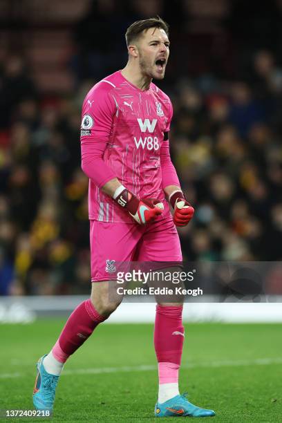 Jack Butland celebrates after teammate Wilfried Zaha of Crystal Palace scored their sides third goal during the Premier League match between Watford...