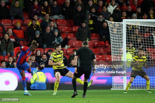 Wilfried Zaha of Crystal Palace scores their team's fourth goal during the Premier League match between Watford and Crystal Palace at Vicarage Road...