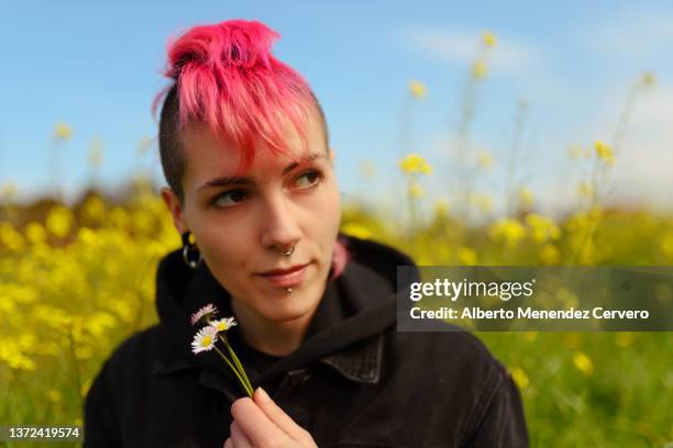 girl in a field with flowers in spring - mohawk stock pictures, royalty-free photos & images