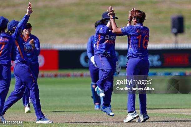 Indian bowler Meghna Sing celebrates taking the wicket of White Fern Suzie Bates during game five in the One Day International series between the New...