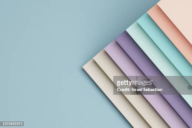 3d illustration of abstract pastel colored lines paper background. - light blue paper stock pictures, royalty-free photos & images