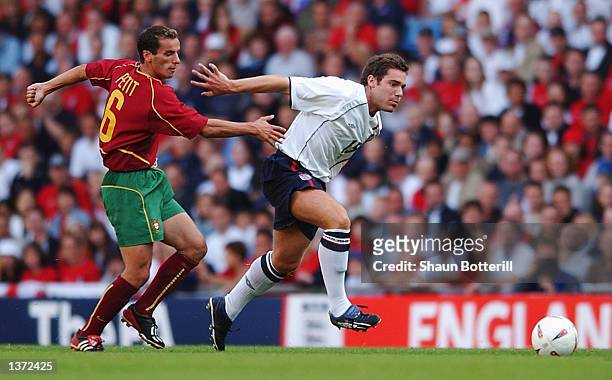 David Dunn of England clashes with Armando Teixeira of Portugal during the England v Portugal International Friendly match at Villa Park in...