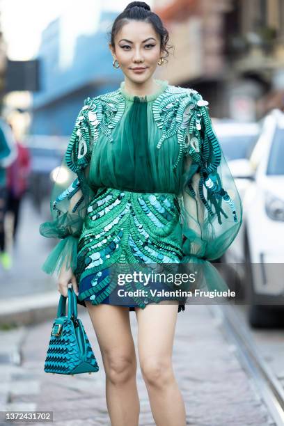 Jessica Wang poses ahead of the Alberta Ferretti fashion show wearing a sequin paillettes green dress during the Milan Fashion Week Fall/Winter...