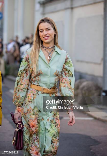 Guest is seen wearing button up green dress with floral print, brown belt outside of Alberta Ferretti fashion show during the Milan Fashion Week...